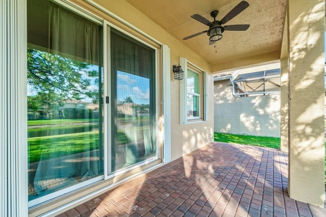 view of patio with ceiling fan