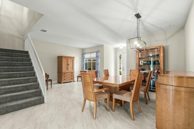 dining space with a notable chandelier