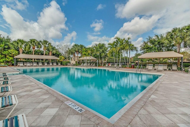 view of swimming pool featuring a gazebo and a patio