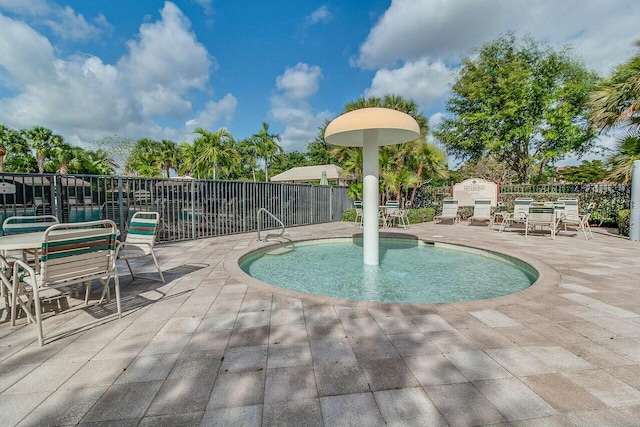 view of swimming pool featuring a patio area