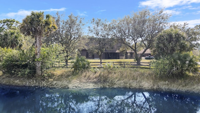 back of house featuring a water view