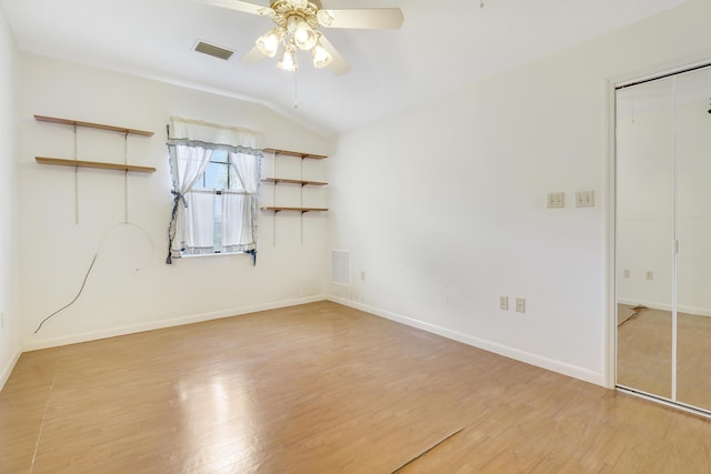 unfurnished room featuring vaulted ceiling, ceiling fan, and light hardwood / wood-style flooring