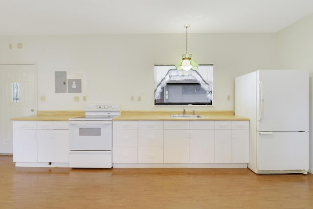 kitchen featuring hanging light fixtures, white appliances, sink, and white cabinets