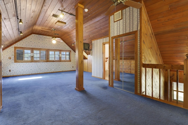 additional living space with dark colored carpet, ceiling fan, lofted ceiling, and wood ceiling