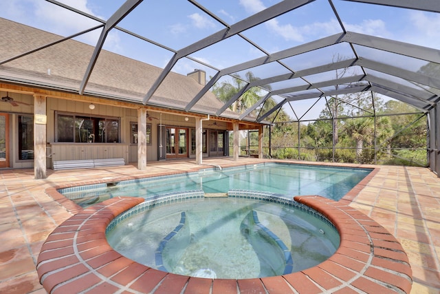 view of swimming pool featuring a lanai, a patio area, ceiling fan, and an in ground hot tub