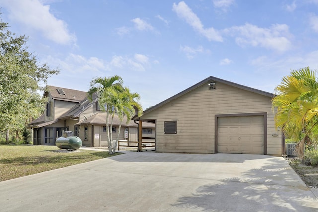 view of front of property with a garage and a front yard