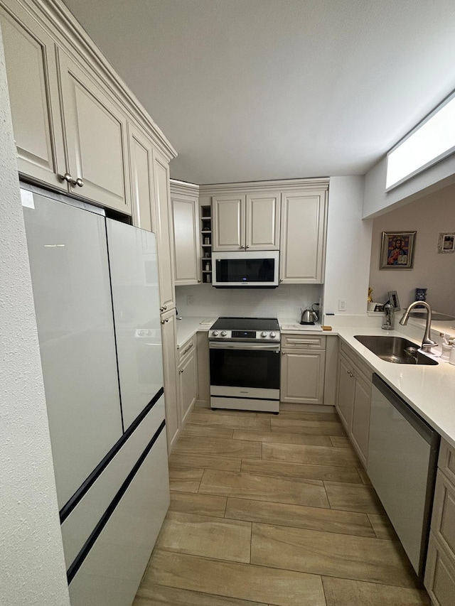 kitchen with sink, white appliances, and kitchen peninsula