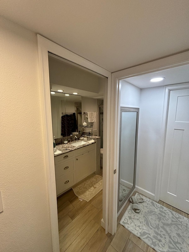 bathroom featuring vanity and a shower