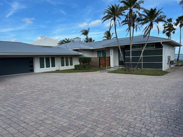 single story home featuring a garage