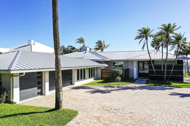 single story home with a garage