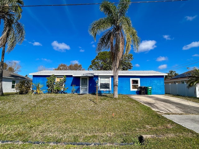 ranch-style house with a front yard