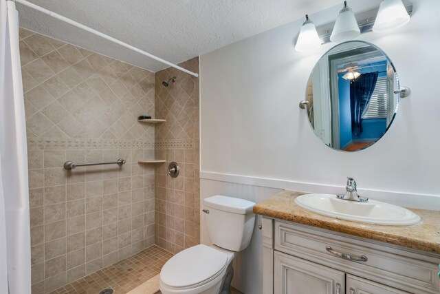 bathroom with walk in shower, toilet, and a textured ceiling