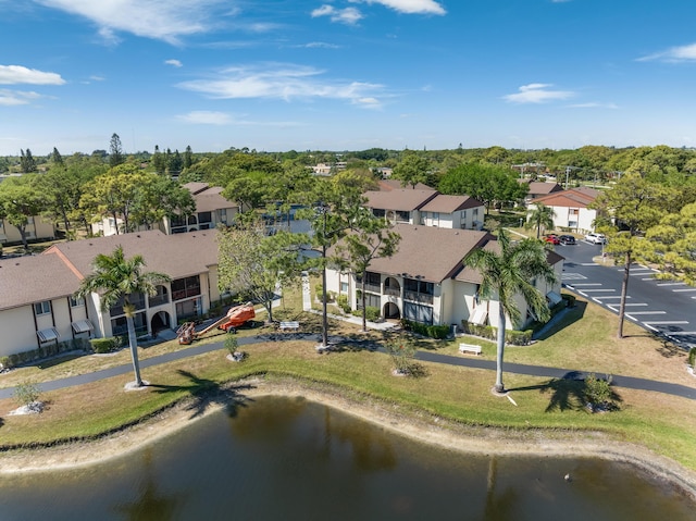 bird's eye view with a water view and a residential view