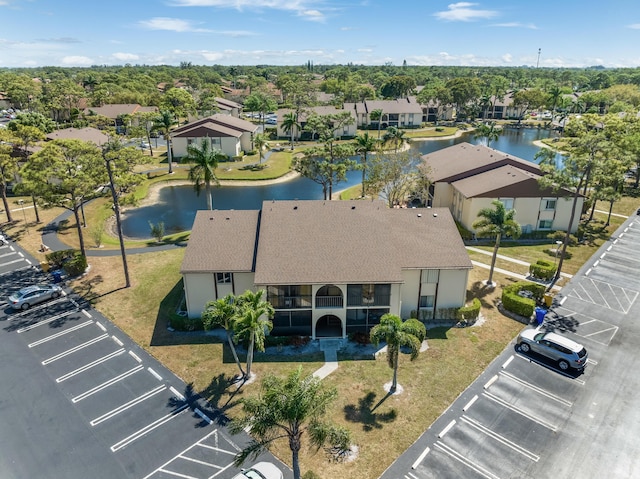 aerial view with a residential view and a water view