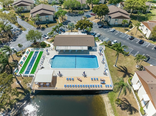 birds eye view of property with a water view