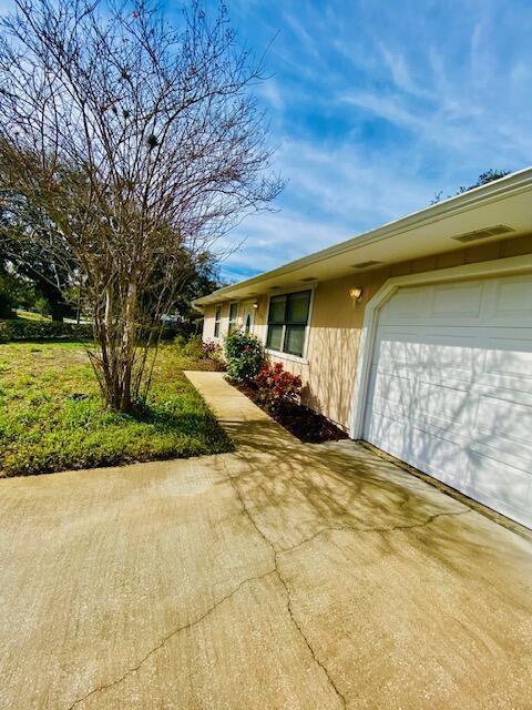 view of property exterior featuring a garage