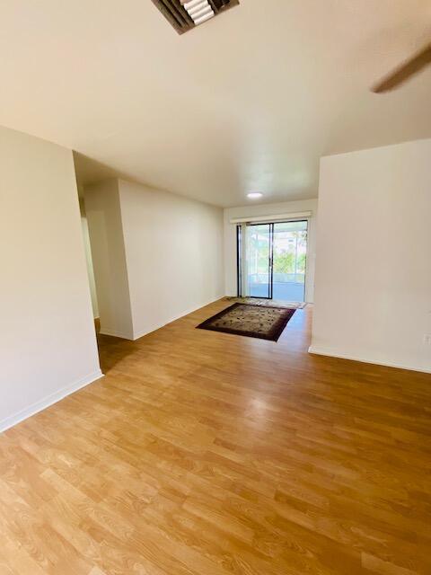 empty room with light hardwood / wood-style floors