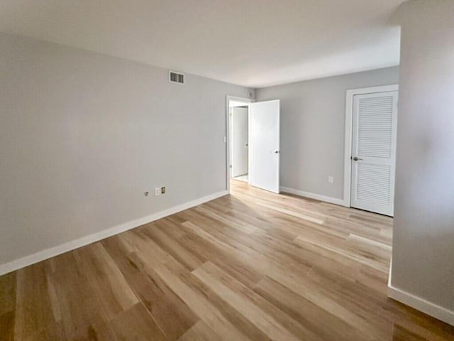 unfurnished room with light hardwood / wood-style flooring