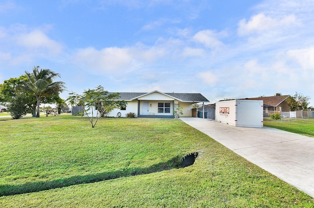 ranch-style home featuring a front lawn