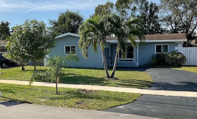 ranch-style house with a front yard