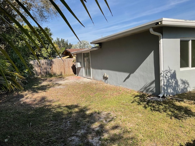 view of home's exterior featuring a lawn