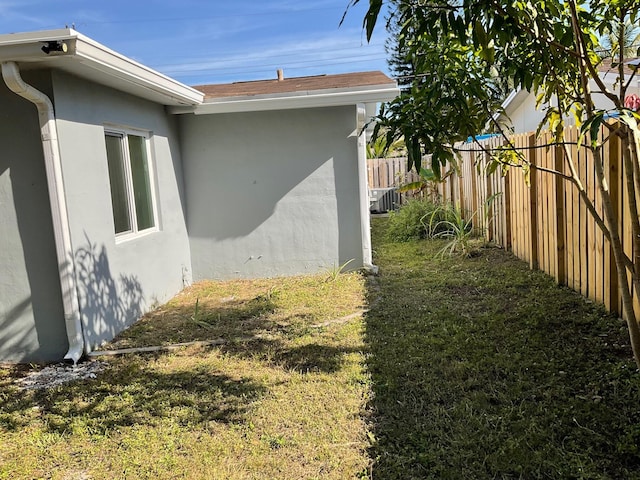 view of home's exterior with a lawn