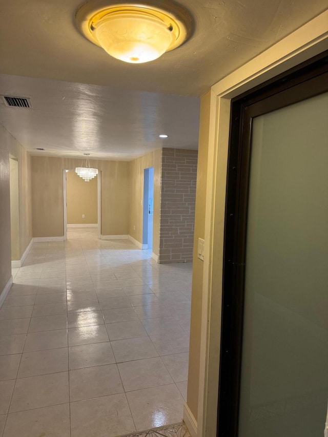 hallway with light tile patterned floors