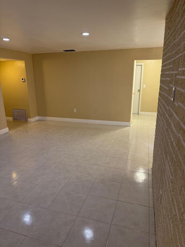 empty room featuring light tile patterned floors