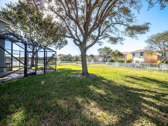 view of yard featuring a lanai