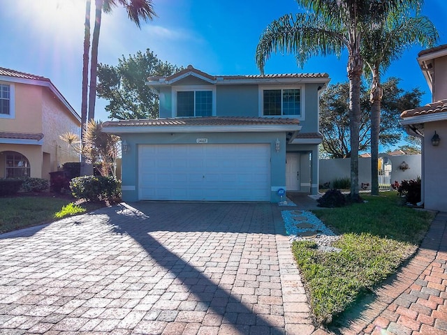 front of property featuring a garage and a front lawn