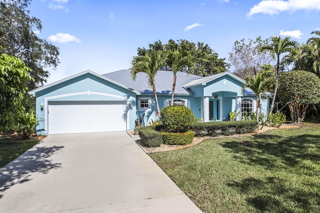 single story home with a garage and a front yard