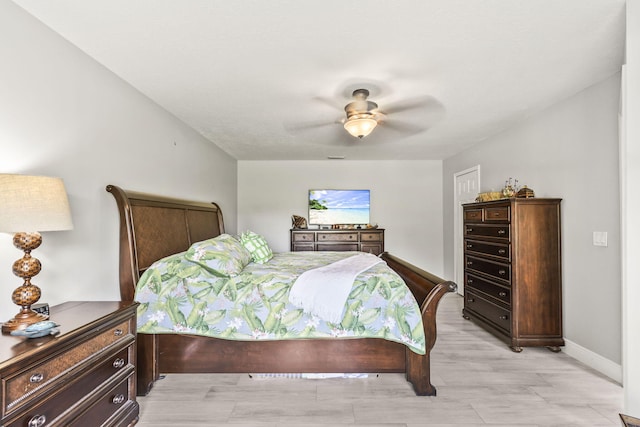 bedroom with light wood-type flooring and ceiling fan