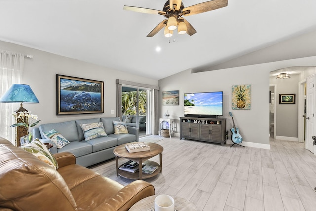 living room with lofted ceiling, ceiling fan, and light hardwood / wood-style flooring