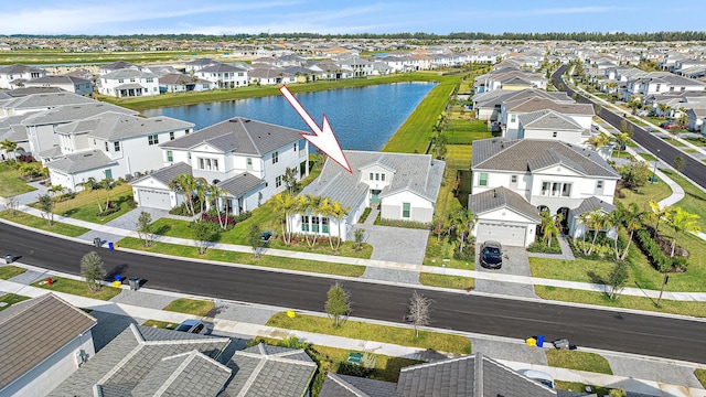 birds eye view of property featuring a water view