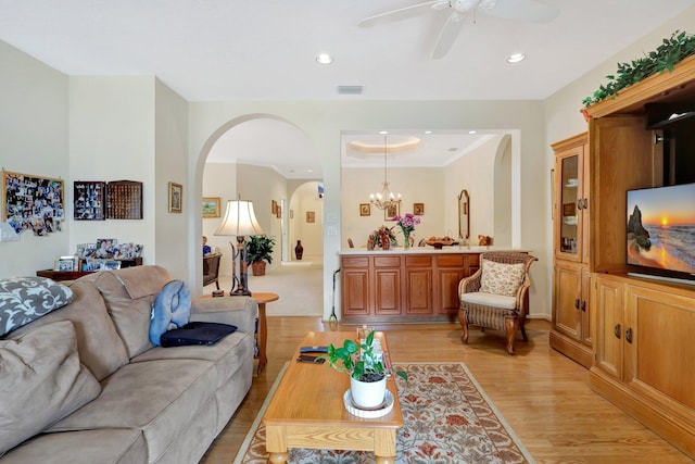 living room featuring ceiling fan and light hardwood / wood-style floors