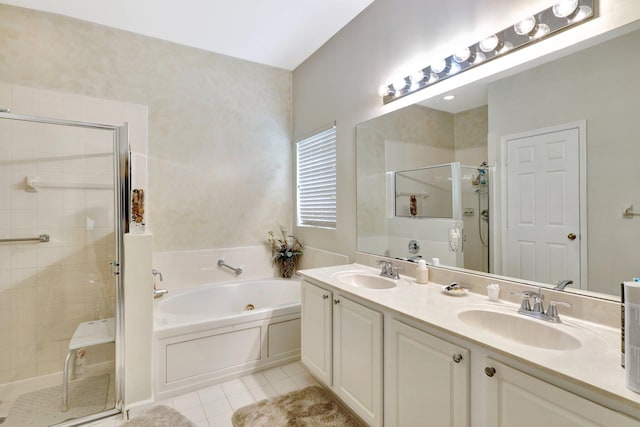 bathroom with tile patterned flooring, vanity, and separate shower and tub