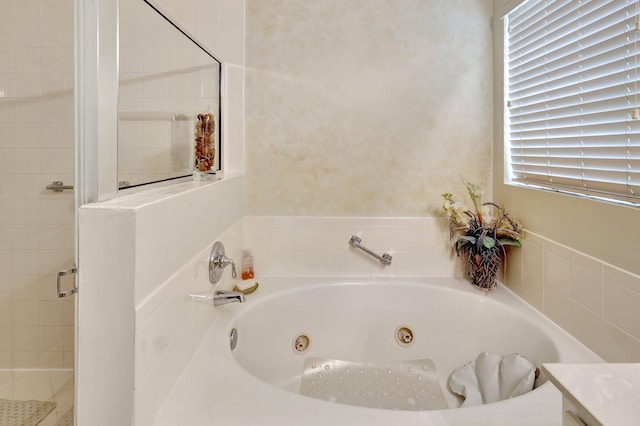 bathroom with vanity and a bath