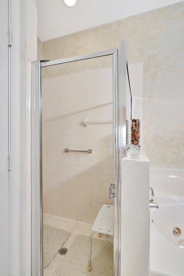 bathroom featuring plus walk in shower