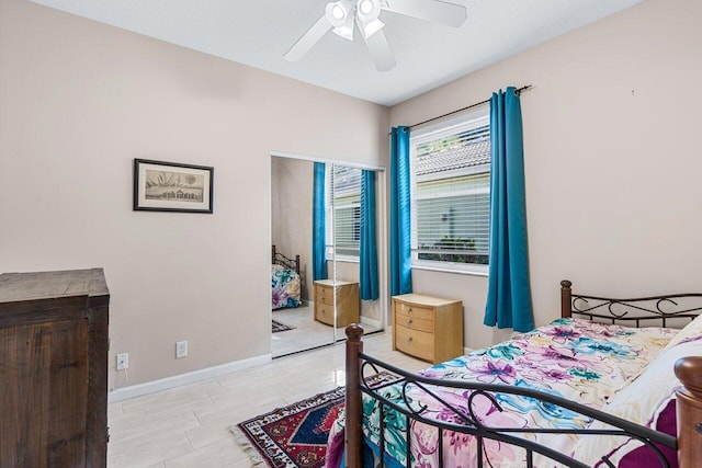 bedroom featuring ceiling fan and a closet