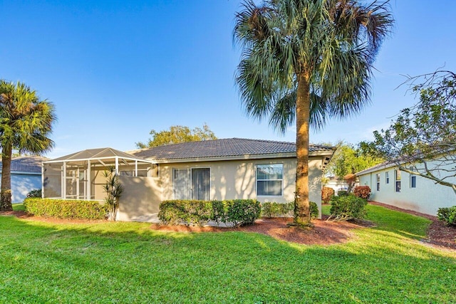 single story home with a lanai and a front lawn