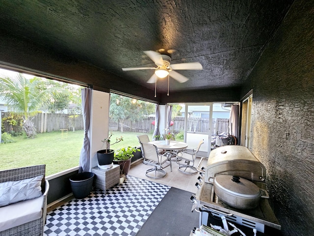 sunroom / solarium with ceiling fan