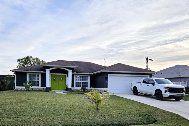 ranch-style home with a garage and a front lawn