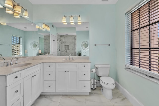 bathroom with vanity, toilet, and walk in shower