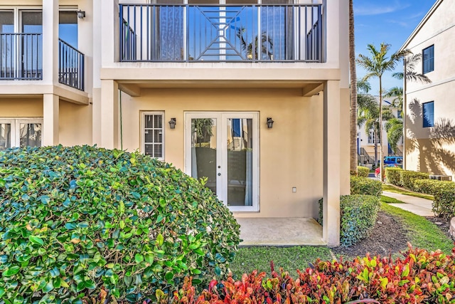 entrance to property featuring a patio and french doors