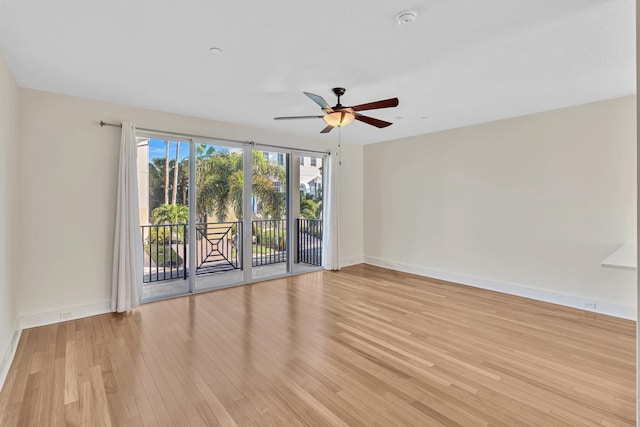 spare room featuring light hardwood / wood-style flooring and ceiling fan