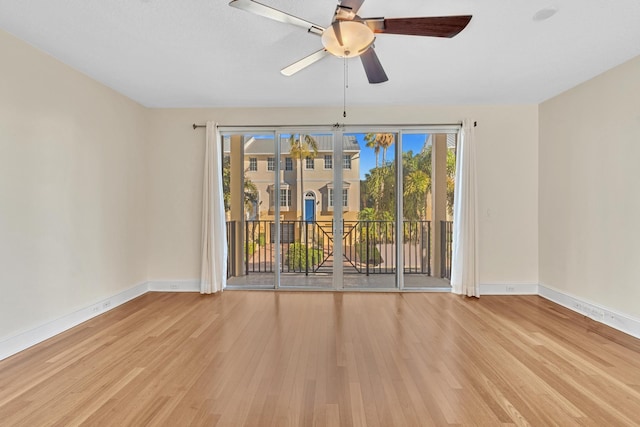 unfurnished room featuring ceiling fan and light wood-type flooring