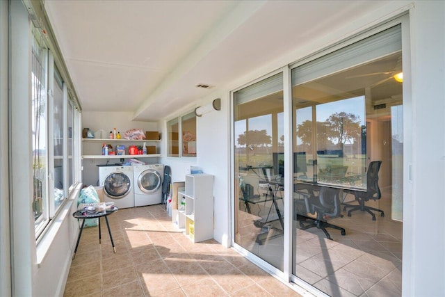 laundry room with light tile patterned floors and independent washer and dryer