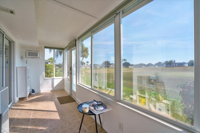 sunroom with a wall mounted air conditioner