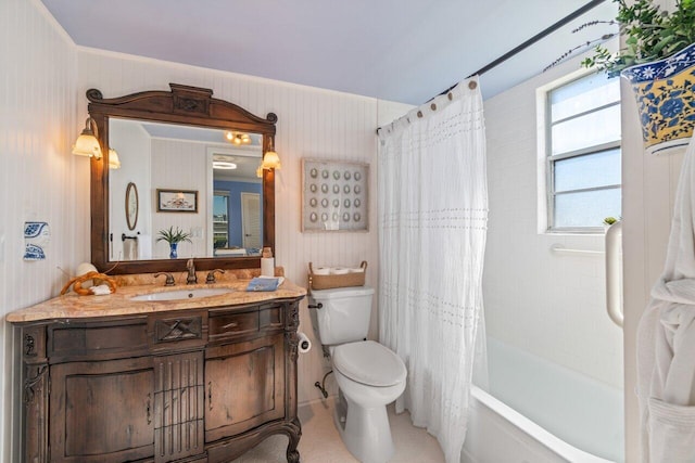 full bathroom featuring vanity, shower / bath combo, and toilet