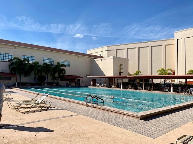 view of swimming pool featuring a patio